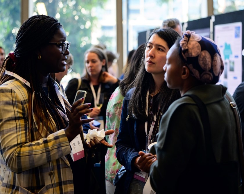 Delegates networking during AASW 80th-anniversary summit reception